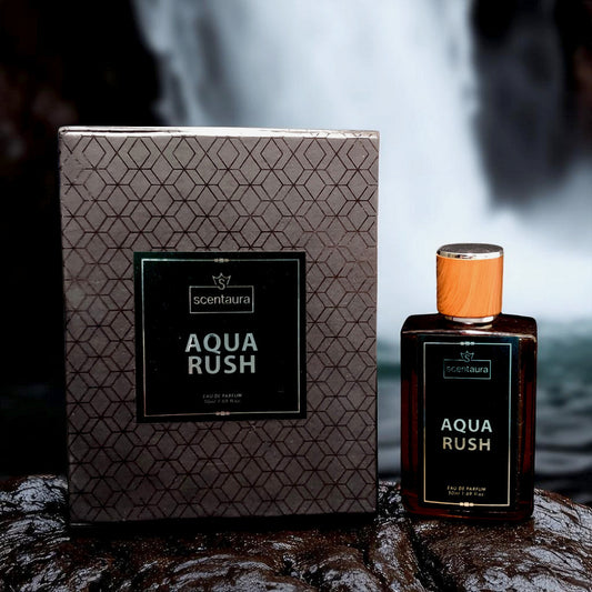 Scentaura Aqua Rush perfume bottle and packaging on a dark surface with a blurred background