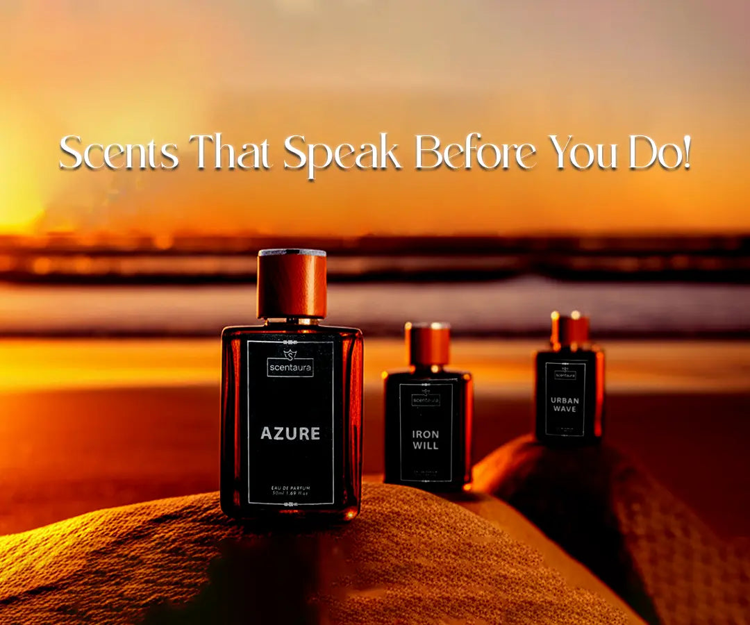 Perfume bottles labeled 'Azure' and 'Iron Will' on a sand dune with a sunset background.