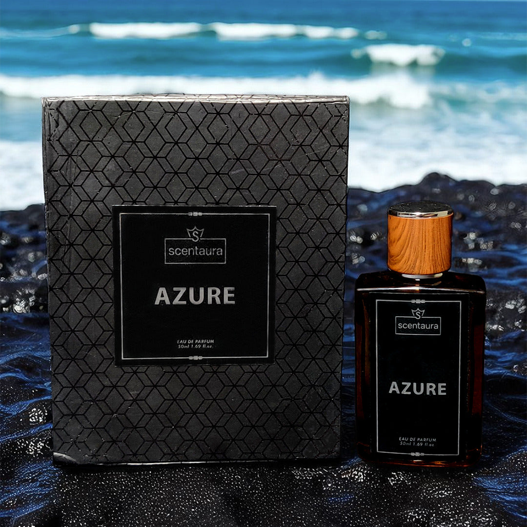 Scentaura Azure perfume bottle and packaging on a beach with ocean waves in the background