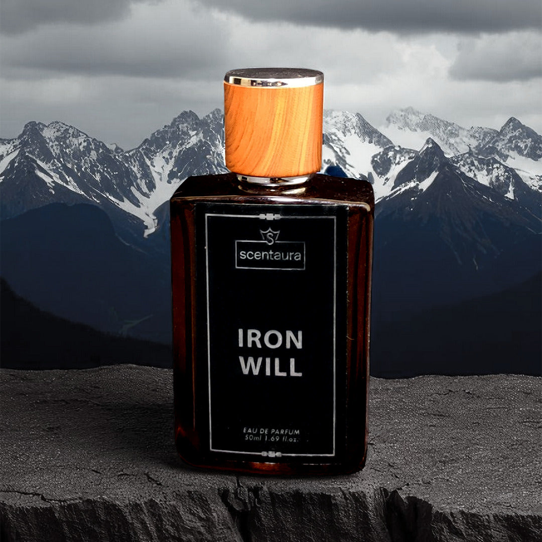 Perfume bottle labeled 'Iron Will' with a mountainous background