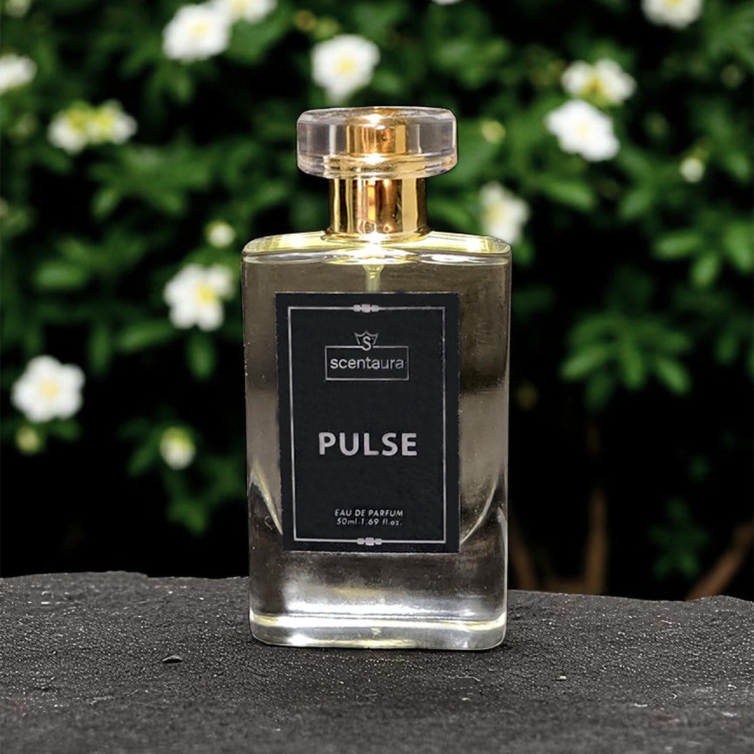Perfume bottle labeled 'Pulse' by 'scentaura' with a blurred natural background
