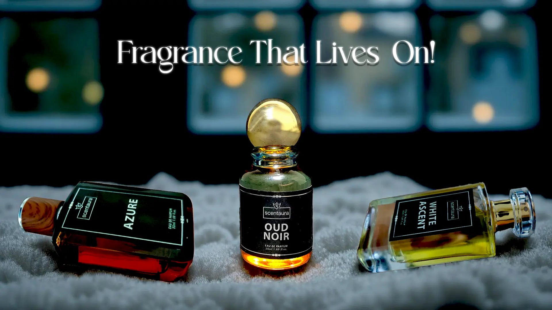 Three perfume bottles with labels on a textured surface, featuring the text 'Fragrance That Lives On!'.